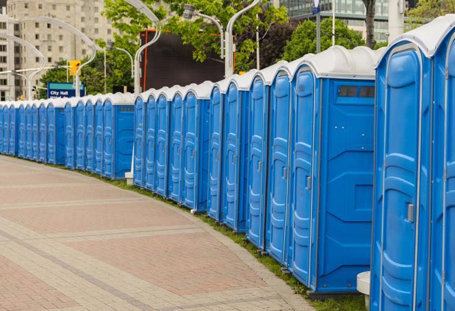 hygienic portable restrooms lined up at a music festival, providing comfort and convenience for attendees in Lake Clarke Shores